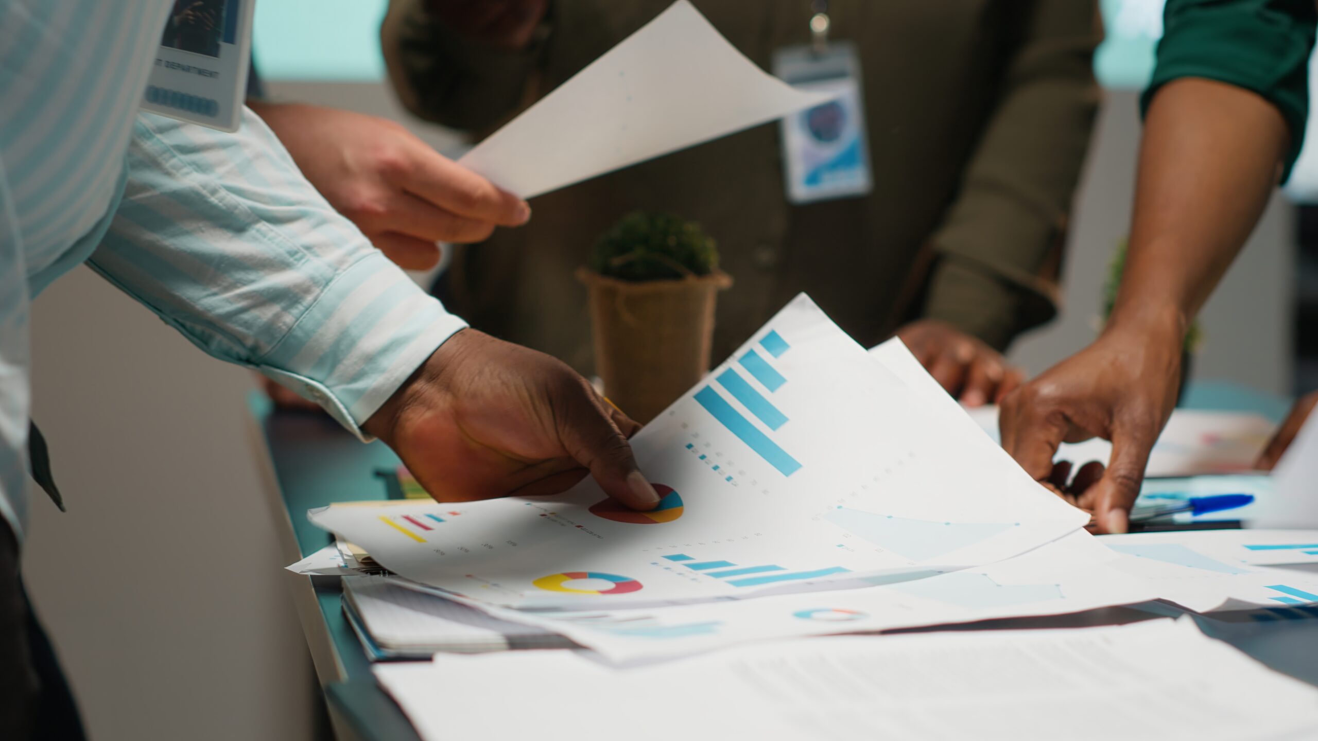 Dero & Associates team reviewing analytics